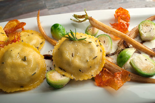 Portabella Mushroom Ravioli with Parsnip Crème, Brussels Sprouts and Tomato Leaf