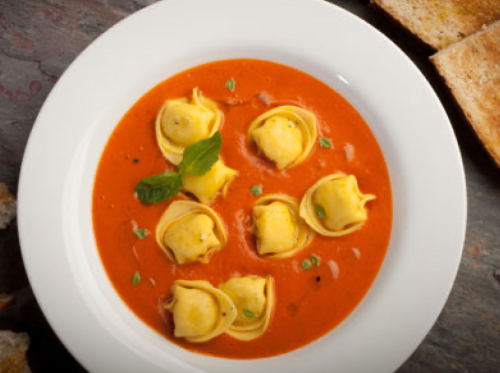 Tortellini in a bowl of tomato bisque