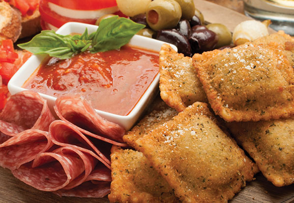 platter with toasted ravioli, salami and olives